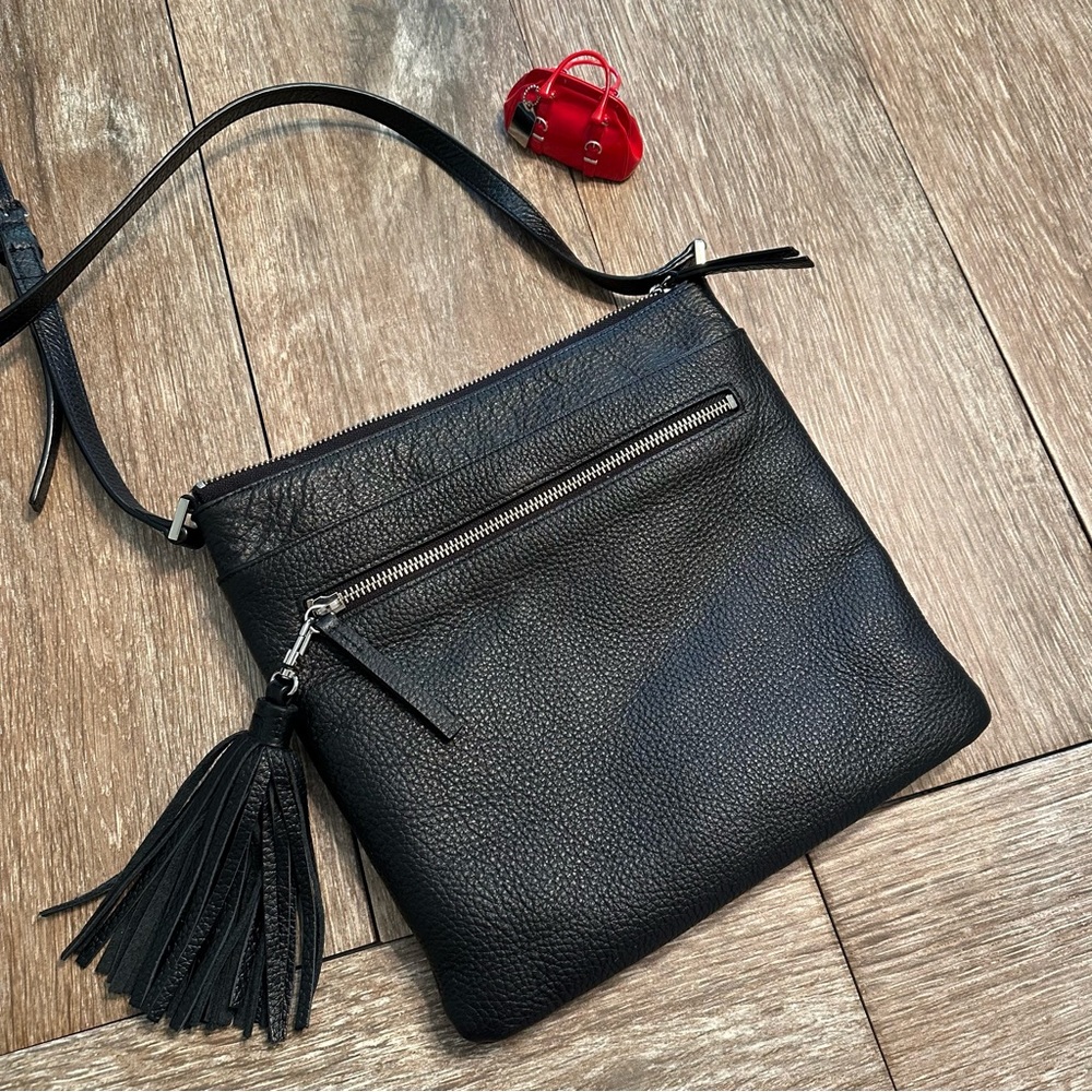 Black pebbled leather multi-pocket crossbody bag with detachable tassel ā¦